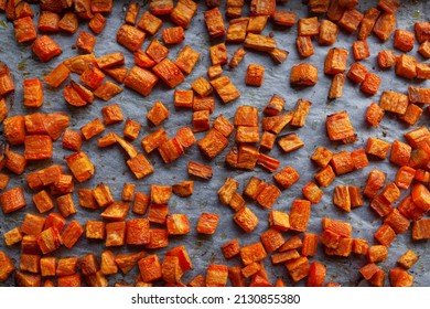 Oven roasted carrots and sweet potatoes on a parchment paper, cut into cubes   - Powered by Shutterstock