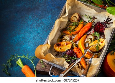 Oven Roasted Vegetables With Garlic And Herbs On The Baking Tray. Autumn-winter Root Vegetables.