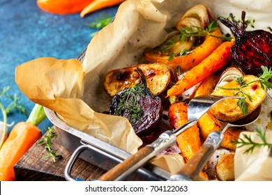 Oven Roasted Vegetables With Garlic And Herbs On The Baking Tray. Autumn-winter Root Vegetables.