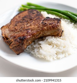 Oven-roasted Gourmet Bone-in Pork Chop Meal With Rice And Asparagus