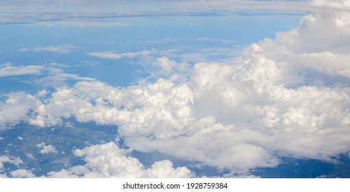over the clouds,Blue sky with tiny clouds background Beautiful natural view from airplane window above. Background or Wallpaper.blue sky and cloud sky nature.Top view of aircraft