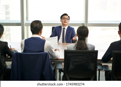 over confident young asian business person talking big in front of hr interviewers during job interview - Shutterstock ID 1745983274