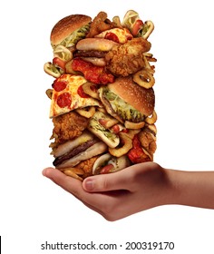 Over Eating And Compulsive Indulgence Of Fast Food Concept As A Hand Holding Up A Huge Stack Of Junk Food As Hamburgers Hotdogs And French Fries As An Unhealthy Diet And Bad Nutrition Symbol.