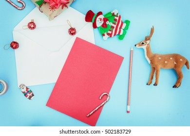 Over head flat lay mock up of Christmas items and letter writing supplies