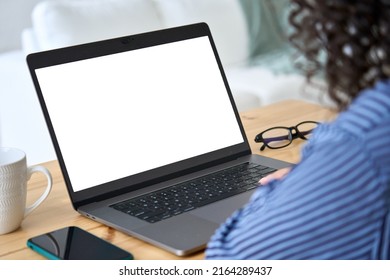 Over Shoulder Closeup View Of Female Student Or Business Woman Looking At Empty Blank Mock Up Laptop Screen For Advertising, Having Virtual Class. Remote E Learning Online Work Concept.