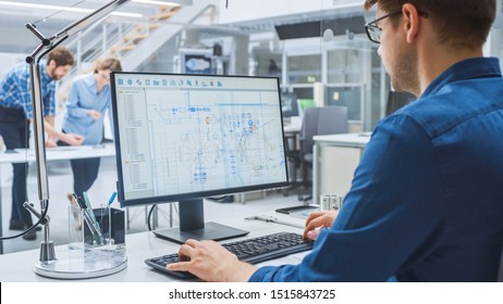 Over the Shoulder Shot of Engineer Working with CAD Software on Desktop Computer, Screen Shows Technical Drafts and Drawings. In the Background Engineering Facility Specialising on Industrial Design - Shutterstock ID 1515843725