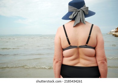 Over Size Middle Aged Woman Wearing In Swimming Suit Enjoy Of Summer Vacation On Ocean Or Sea Beach. Outdoors