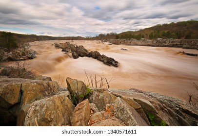 Over View Of Rapids Of Potomac River In Slow Motion At Sunset In Great Falls Park, Virginia. Great Falls Park Is A Small National Park Service Site In Virginia Near Washington DC, United States.