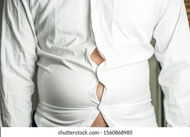 Over Weight Concept, Fat Man With Big  Belly With A Fit White Shirt.