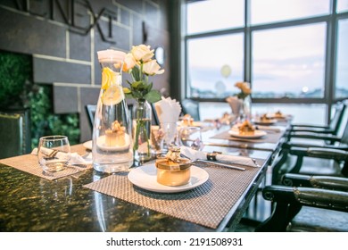 The Overall Arrangement Of The Wedding Table, Including Cutlery, Flowers, Small Gifts.