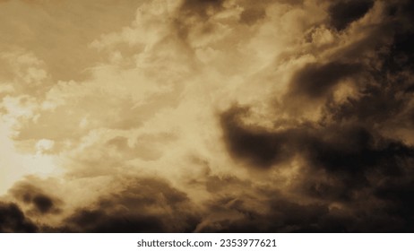Overcast background with light autumn sunset gradient dark golden brown tones. For backdrop cloudy sky weather clouds 