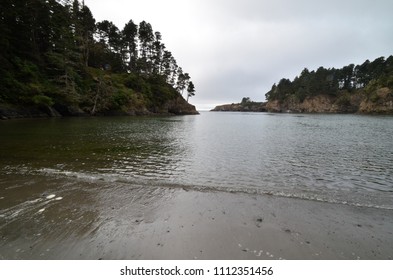 overcast beach with cliffs