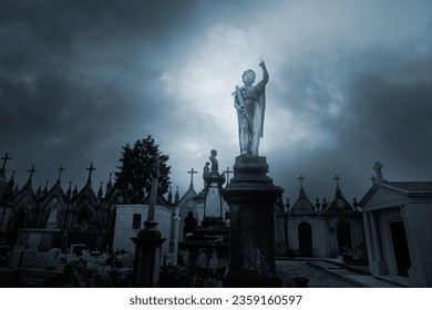 Overcast sad cemeteryb with an angel statue on the foreground - Powered by Shutterstock