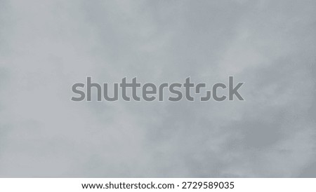 Overcast Sky with Thick Gray Clouds Covering the Sun Background
