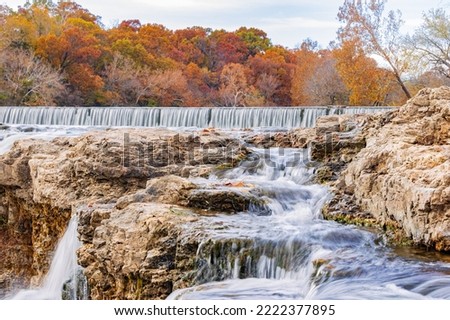 Overcast view of the fall color of Grand Falls at Joplin, Missouri