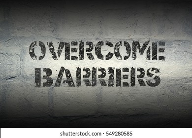 Overcome Barriers Stencil Print On The Grunge White Brick Wall