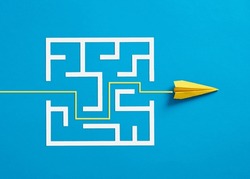 Overcoming The Barriers. Conquering The Obstacles. Way To Success And Business Solutions. Exit Strategy. Paper Plane Breaking Through The Maze On Blue Background.