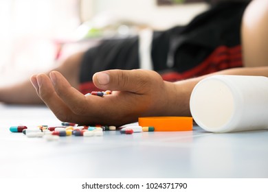 Overdose - Close Up Of Pills And Addict Lying On The Floor