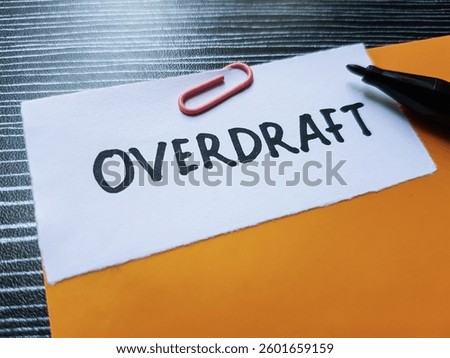 Overdraft writting on table background.