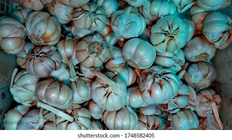 Overexposed And Noise Image Garlic White Garlic Pile Texture. Fresh Garlic On Market Table Closeup Photo. Vitamin Healthy Food Spice Image. Spicy Cooking Ingredient Picture. Pile Of White Garlic Heads