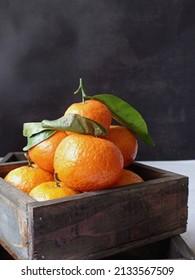 Overexposed Tangerines In Wooden Tray