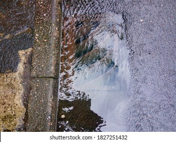 Overflowing Drain With Run Off Rain Water UK