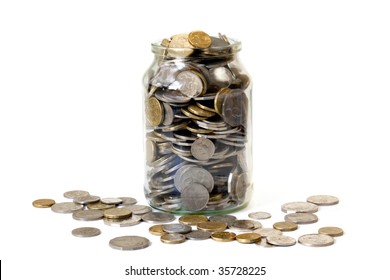 Overflowing jar of Australian coins, isolated on white.