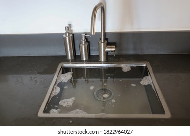 Overflowing Kitchen Sink, Clogged Drain. Plumbing Problems.