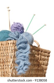 overflowing knitter's basket, isolated on white