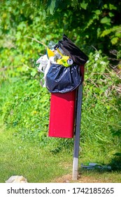 Overflowing Rubbish Bin In The Park