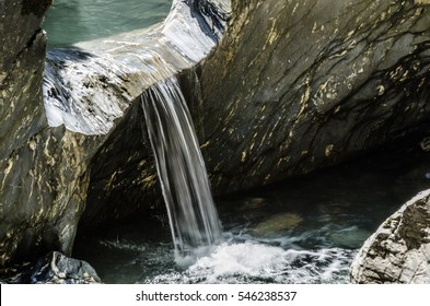overflowing water at rocks in a ravine