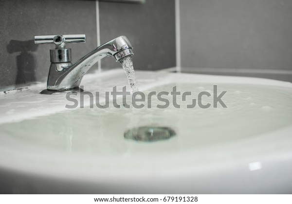 Overflowing water from the\
washbasin