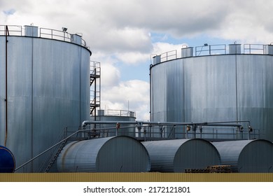 Overground thermal insulated cylindrical storage facilities for bitumen. Bitumen is a residual material used for asphalt production. - Shutterstock ID 2172121801