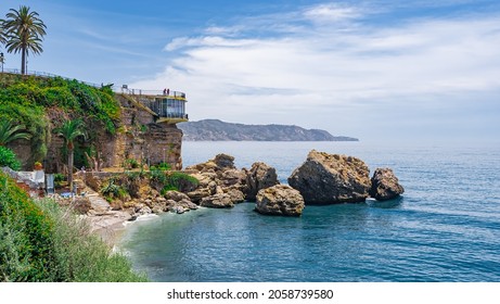 The overhanging cliff of the Balcón de Europa towards the Atlantic Ocean off the coast of Nerja, Malaga, Andalusia, southern Spain.