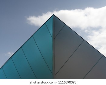Overhanging grey roof of a modern new building in a shopping centre photographed at an acute angle from below in northern Germany - Shutterstock ID 1116890393