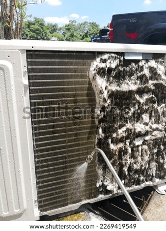 Overhaul chemical cleaning service on air conditioner compressor. Water jet spray chemical foam that reacts to remove dirty dust and substances on coil. 