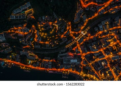 Overhead Aerial Drone Night Shot Of City Street Lights In Lugano, Switzerland