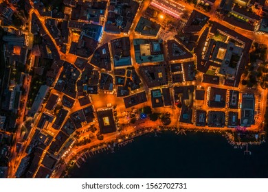 Overhead Aerial Drone Night Shot Of City Street Lights In Lugano, Switzerland