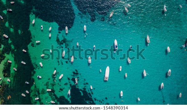 Overhead aerial\
drone view of yachts in mediterranean sea in summer sunny day near\
Nice, cote d\'azur, south\
France