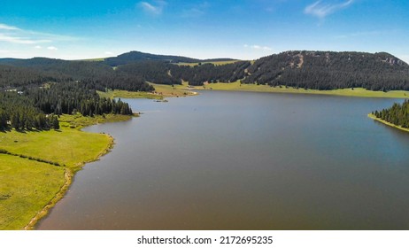 Overhead Aerial View Of Lake Water In Summer.