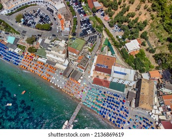 Overhead Aerial View Of Marina Del Cantone Beach On A Sunny Day, Amalfi Coast - Italy. Beach Umbrellas Downward View