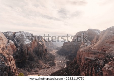 Overhead arial view of the valley in Zion national park with snow capped, tress, and rock formations