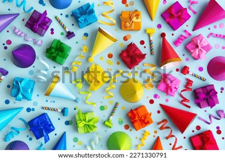 Overhead background collection of colorful birthday party objects in rainbow colors