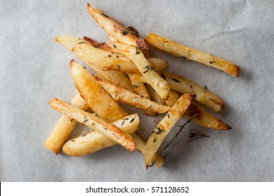 Overhead Of Baked French Fries On A Gray Background