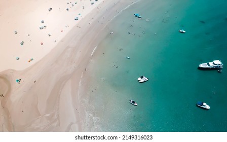 Overhead Beach Drone Shot With People And Boats