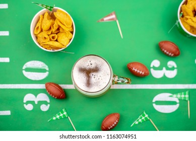 Overhead Beer And Snacks On Table Decorated For The Big Football Game