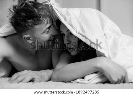 Similar – Happy young couple in love kissing under duvet cover