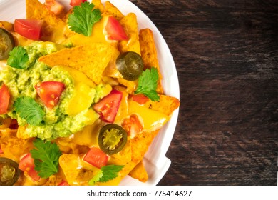 An Overhead Closep Photo Of Nachos With Queso, Traditional Mexican Snack, On A Rustic Background With A Place For Text