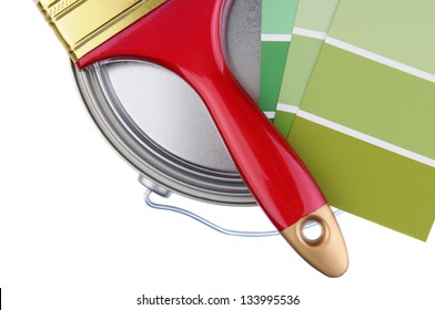 Overhead Closeup Of Painting Supplies Isolated Over A White Background. Paint Brush, And Paint Color Chips Resting On Top Of A Closed Paint Can. Horizontal Format With Copy Space.