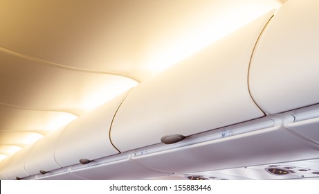 Overhead Compartment - Detail Shot Of An Airplane Cabin Interior